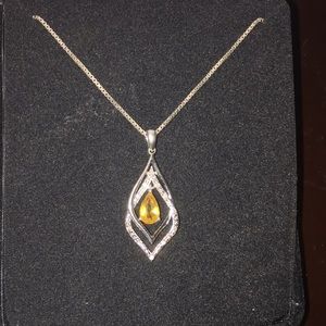 Kay’s Jewelers Authentic Topaz and Diamond pendant